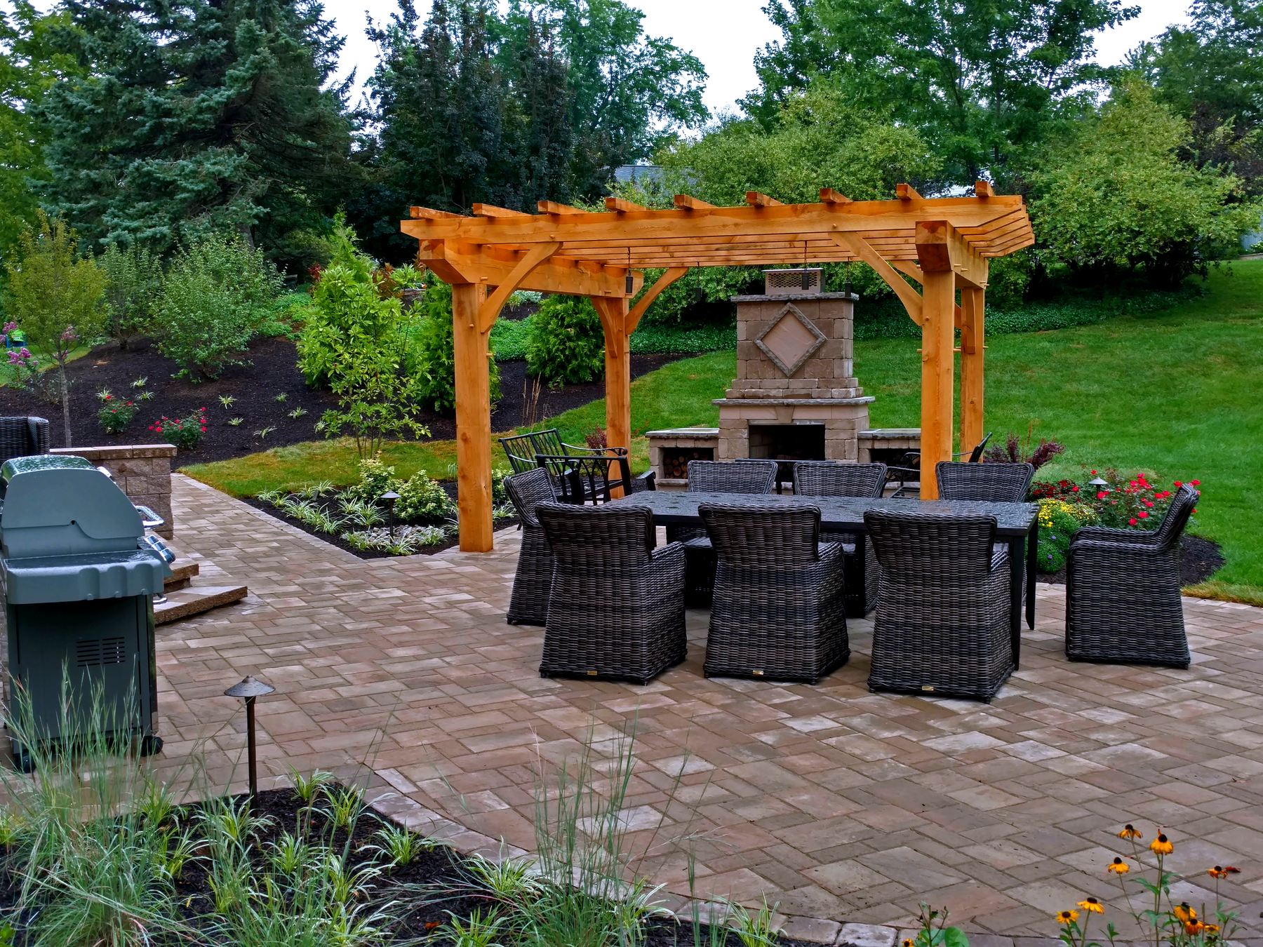 Techo-Bloc paver patio with cedar pergola and stone outdoor fireplace, Allentown PA